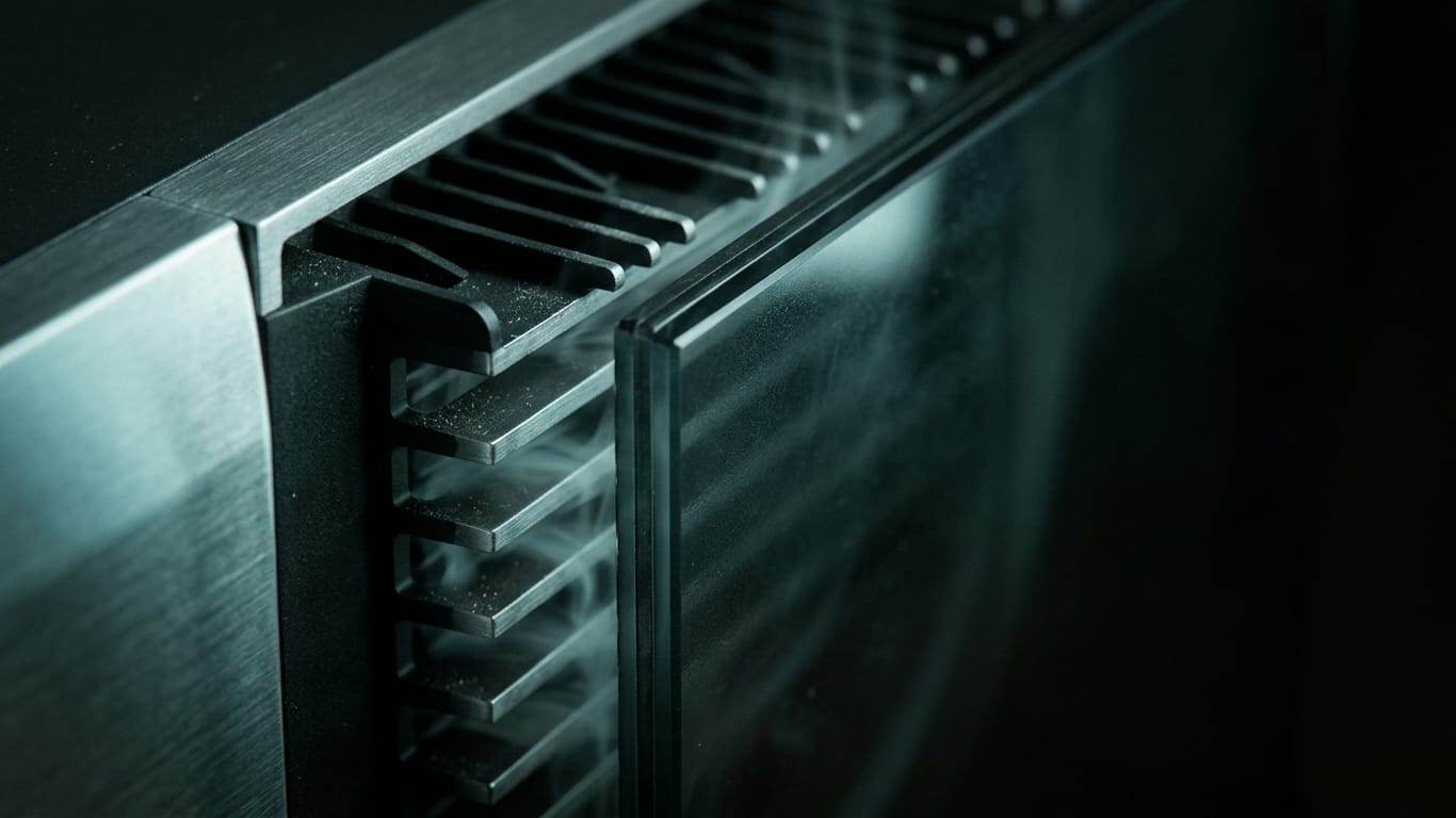 Illustration for this article: AI and the GDPR in 2026. A ventilation grille in deep shadow, cold air distorting the light passing through it.