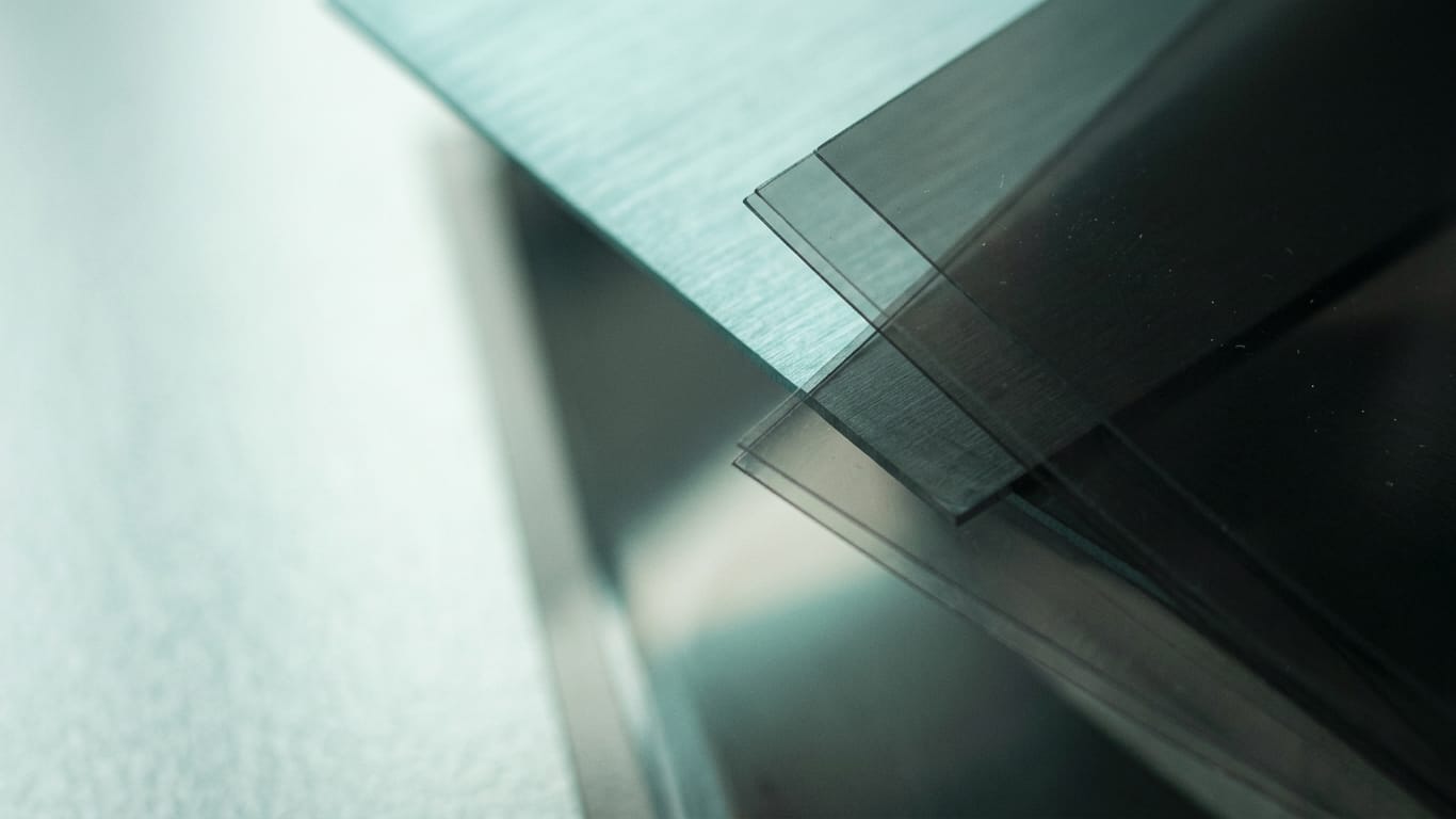 Illustration for this article: Anonymised data is no longer an end state after EDPB Guidelines 02/2026. Layers of translucent film lifted apart, light scattering between the sheets.