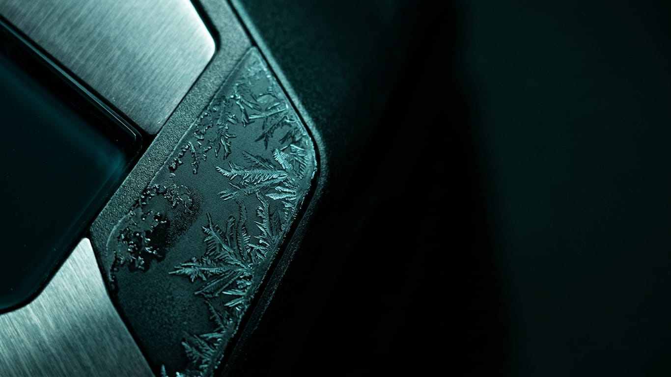 Illustration for this article: Authorisation gap for AI agents in government. Frost crystals spreading across a dark anodised panel, one corner already thawed.