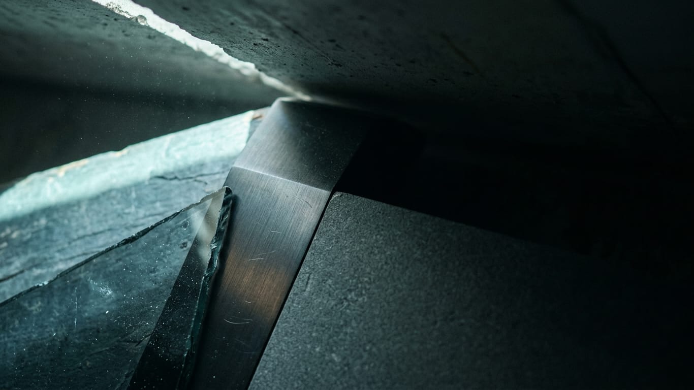 Illustration for this article: Five themes reshaping the legal function by 2030 according to GC research. A shaft of hard daylight crossing a raw concrete soffit, dust suspended in the beam.
