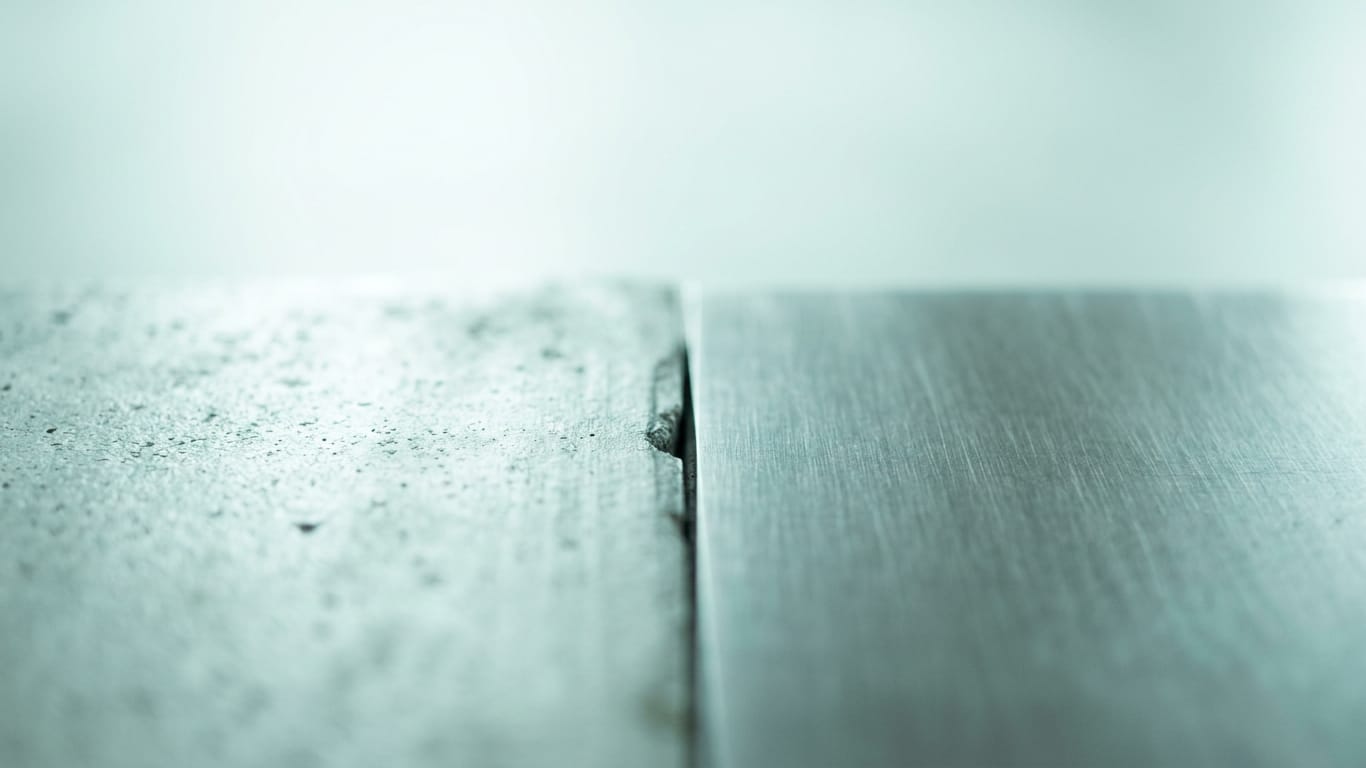 Illustration for this article: Legora builds legal research on an ontology and citator. Poured concrete meeting brushed steel at a tight seam, the joint slightly misaligned.