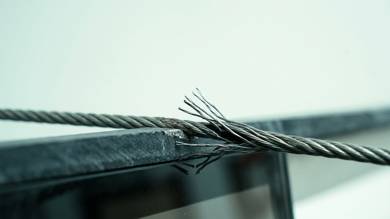 Illustration for this article: Model drift in Codex and GPT in 2026. A steel cable under visible tension, strands separating where it passes over an edge.