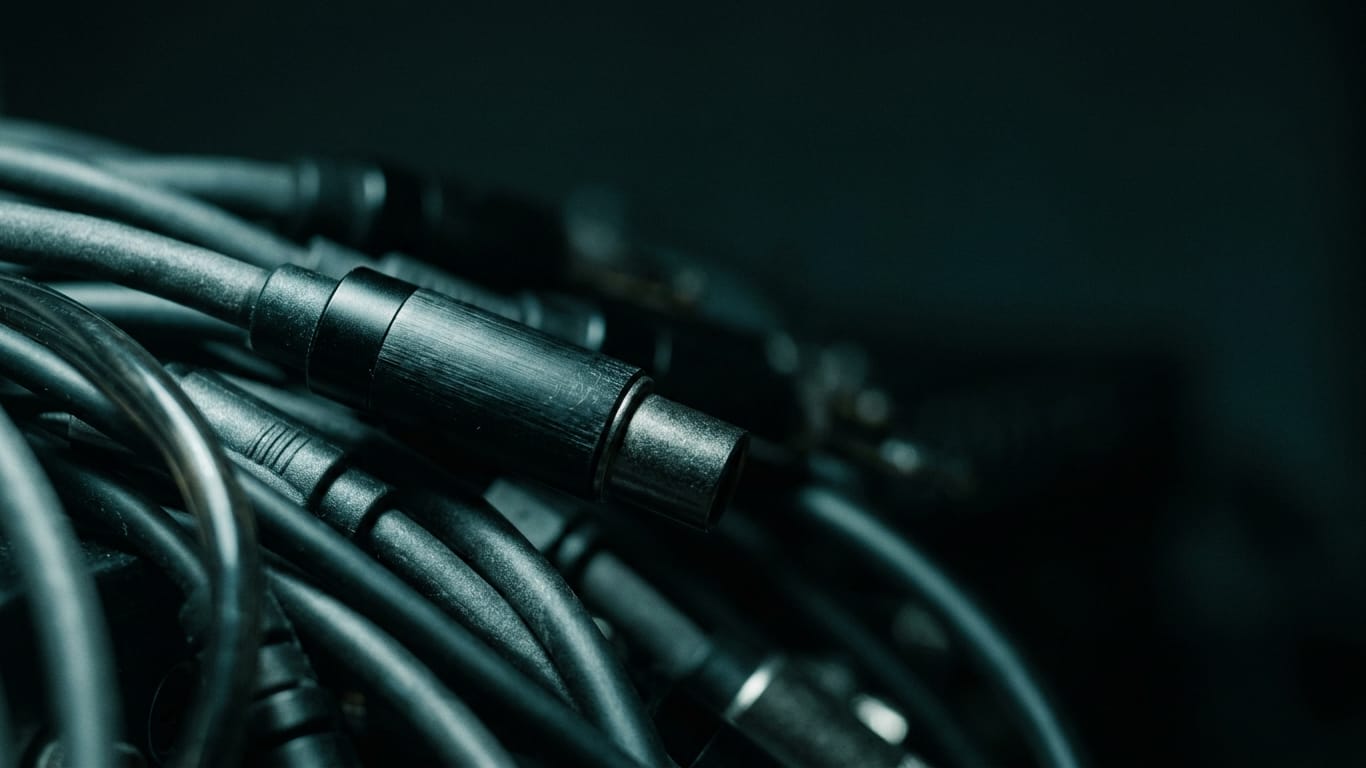Illustration for this article: four measures for generative AI validation. A dense bundle of unbranded patch cables, sharp at one connector and falling out of focus behind.