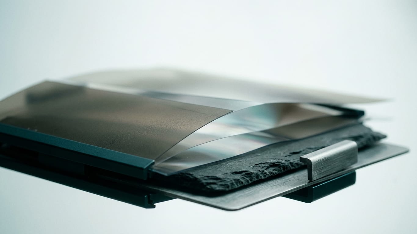 Illustration for this article: Which AI agent could make an investment decision. Layers of translucent film lifted apart, light scattering between the sheets.